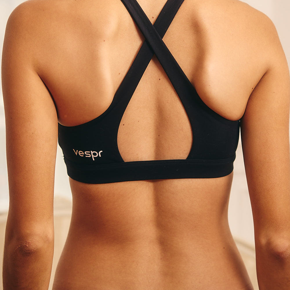 
                      
                        High Neck Criss Cross Open Back Sports Bra with Removable Padding
                      
                    